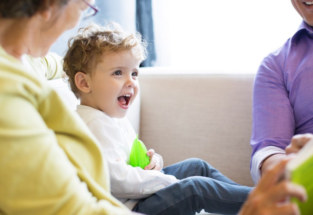 How Many Words Should a 2-Year-Old Know Before Needing Speech Therapy? little boy talking with grandparents