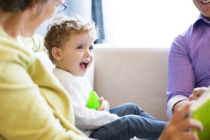 little boy talking with grandparents