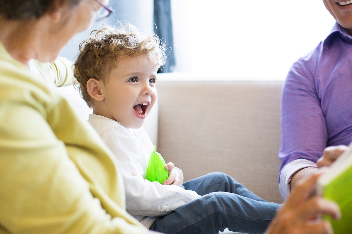 little boy talking with grandparents