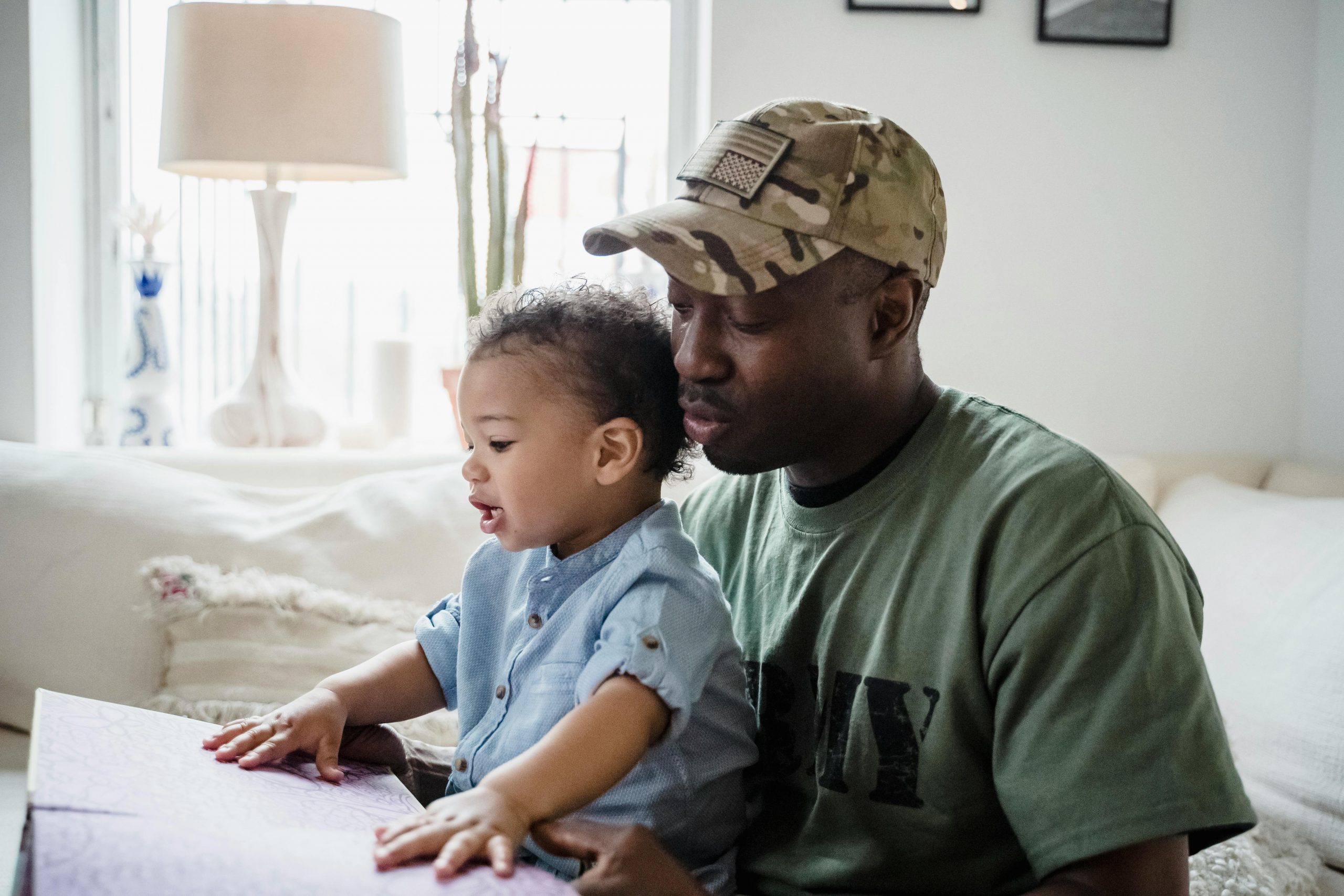 dad and little boy reading a book