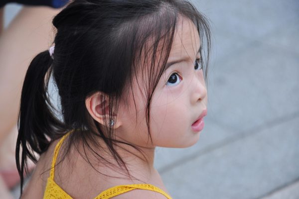 2-Year-Old Not Talking but Understands: When to Consider Speech Therapy puzzled little girl looking up